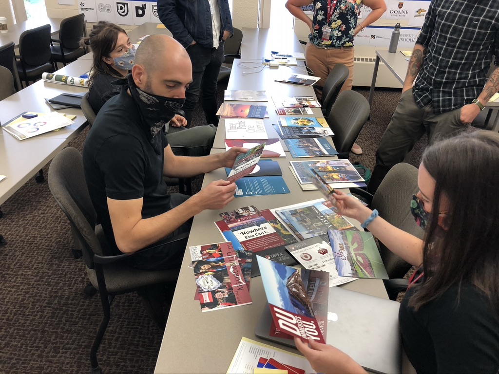 A group of professionals reviewing branded materials.