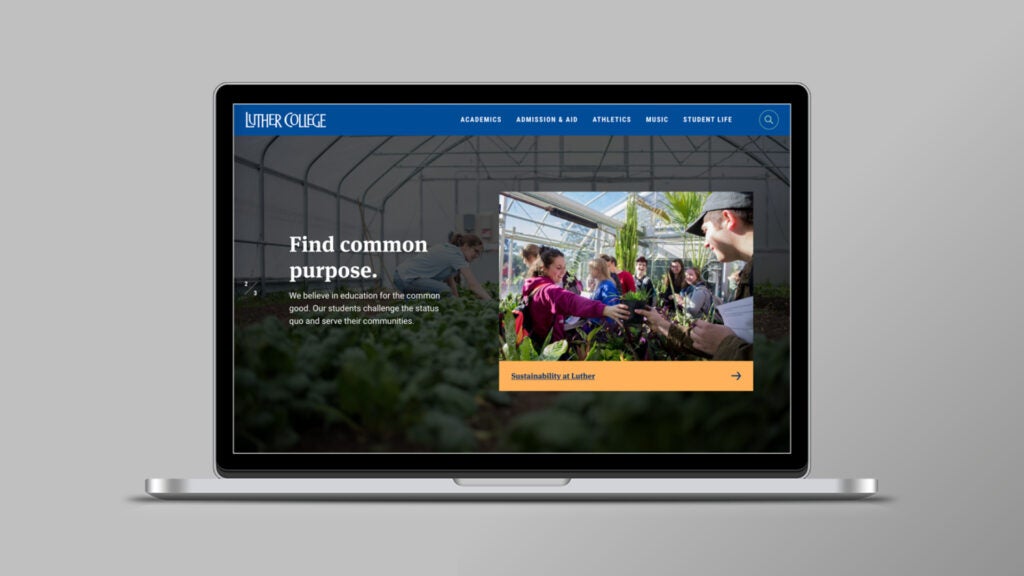 Laptop displaying Luther College website with students gardening in a greenhouse and a "Find common purpose" message.