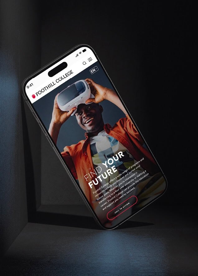 A smartphone displays a Foothill College webpage showing a smiling person using a VR headset.