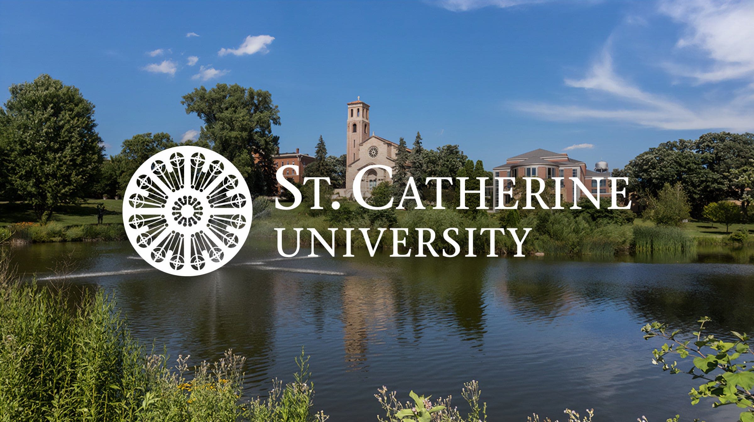 A lake with a fountain, green trees, campus buildings, and blue sky; “St. Catherine University” with a white logo overlays the image.